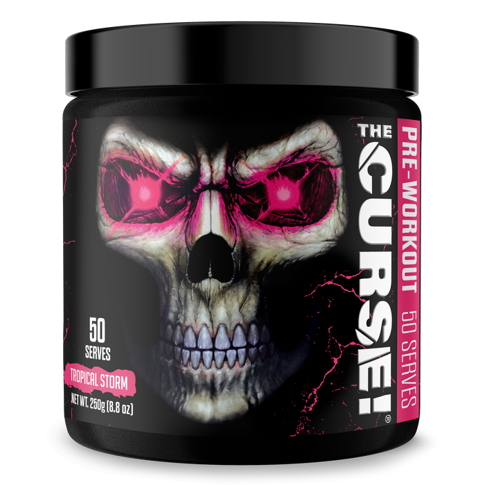A black container of JNX Sports The Curse Pre 50 Servings shows a glowing pink-eyed skull on the label. It delivers intense pumps and focus with 50 Tropical Storm flavor servings. Net weight: 250g (8.8 oz).